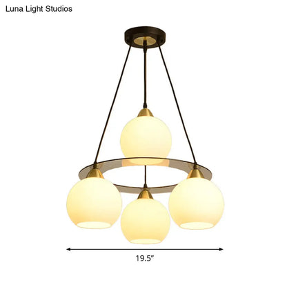 Lámpara de araña contemporánea de 4 luces en negro y dorado con pantalla de cristal opalino