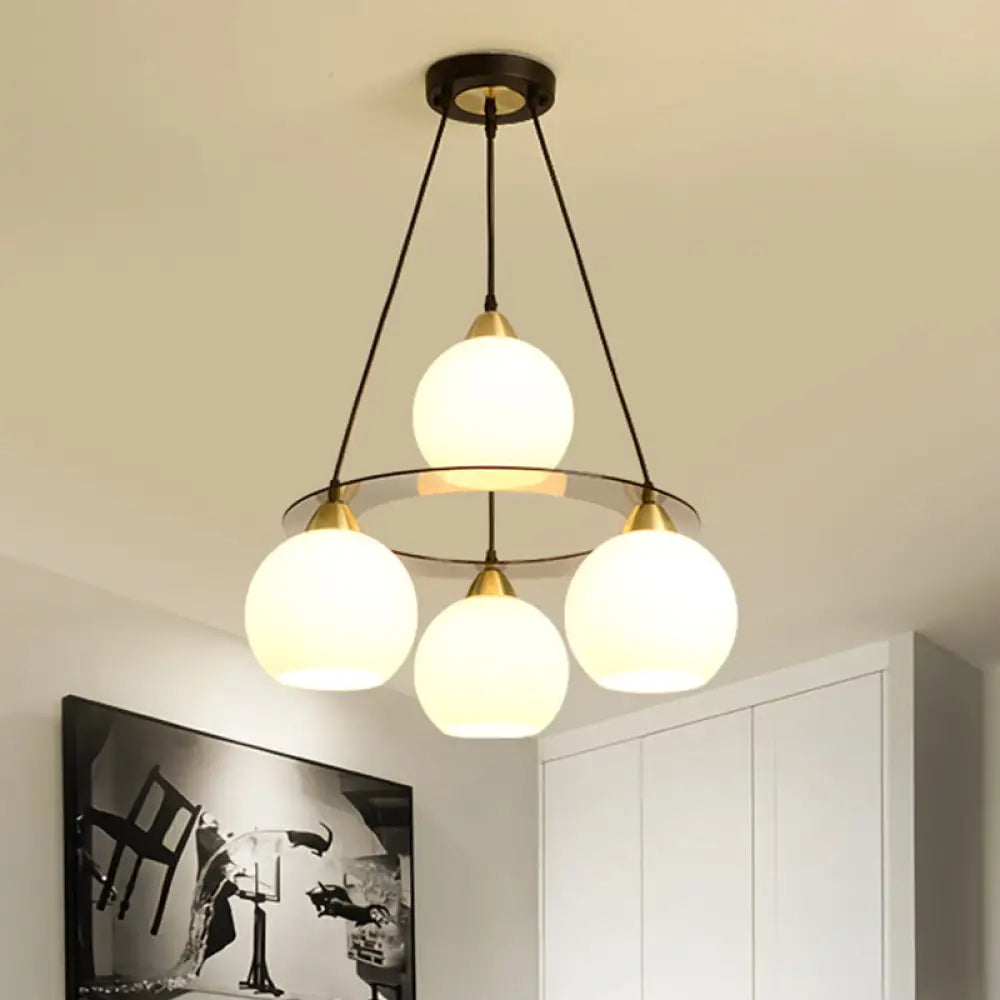 Lámpara de araña contemporánea de 4 luces en negro y dorado con pantalla de cristal opalino