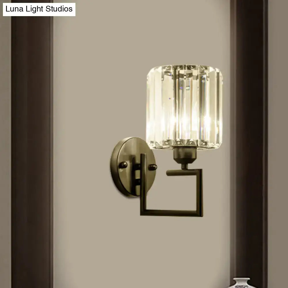 Contemporary black and brass crystal sconce with brushed brass base and faceted crystal shade 110v-120v bedroom light