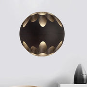 Contemporary black and gold spherical led wall lamp with petal-shaped cutouts for bedroom wall light