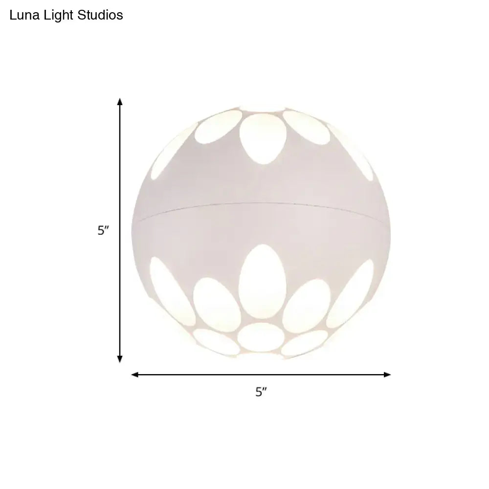 Contemporary white spherical pendant wall light with petal-shaped cutout pattern for bedroom lighting