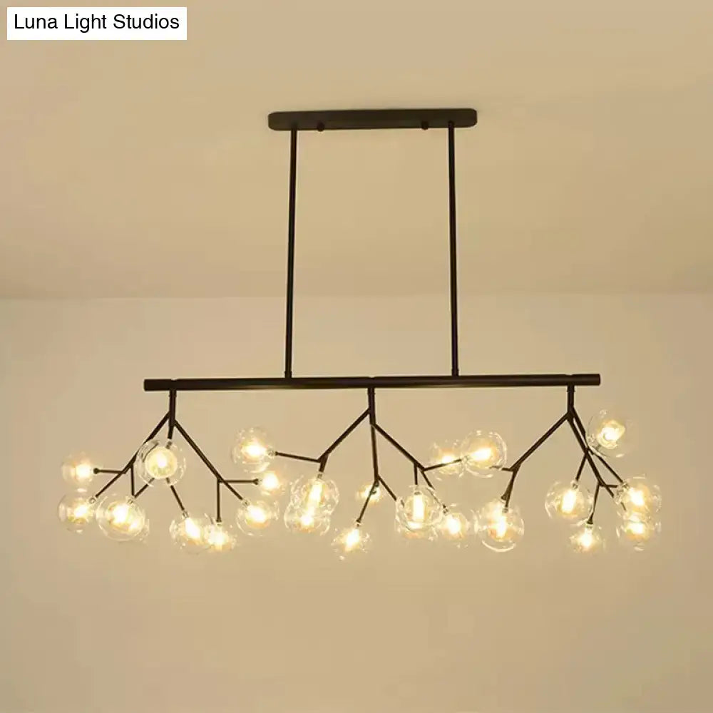 Black metal chandelier with clear glass globe bulbs in a branching design for bubbles island lighting and black finish island lighting