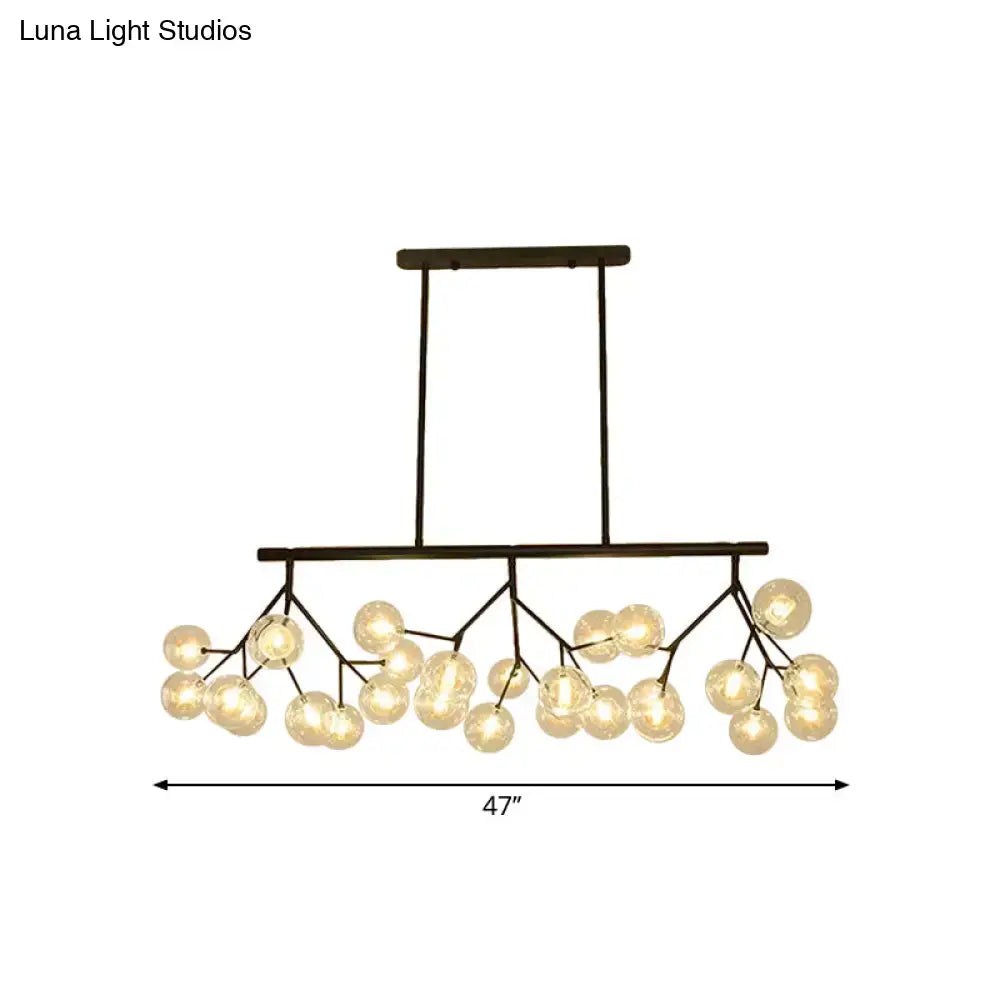 Modern black finish metal chandelier with frosted glass globe bulbs in a branching design for bubbles island lighting