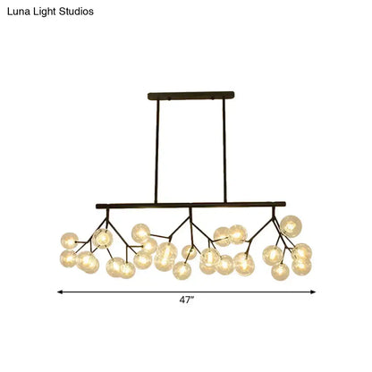 Modern black finish metal chandelier with frosted glass globe bulbs in a branching design for bubbles island lighting