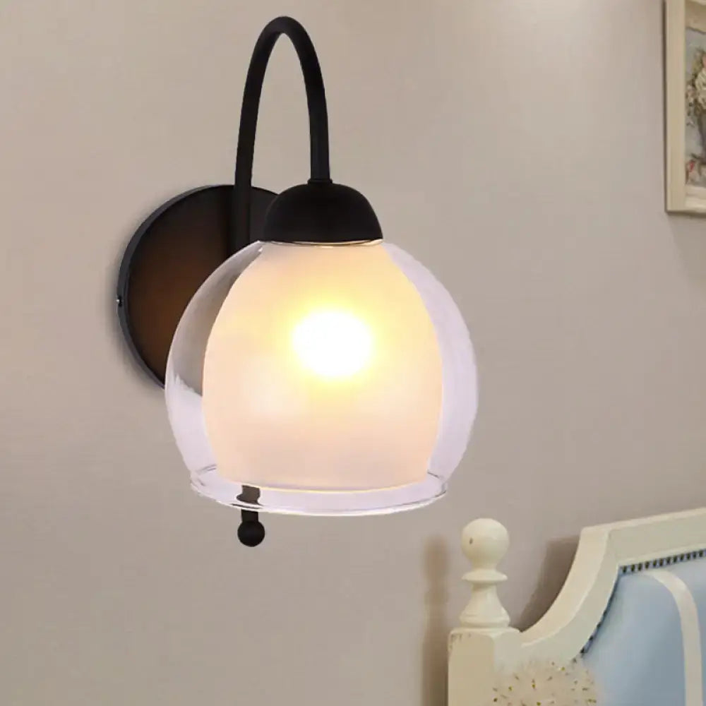 Contemporary black metal wall sconce with frosted glass globe shade for bedroom lighting