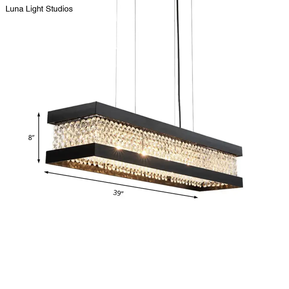Black rectangular DecorBites pendant lighting with gold accents and cascading crystal beads for island pendant lighting