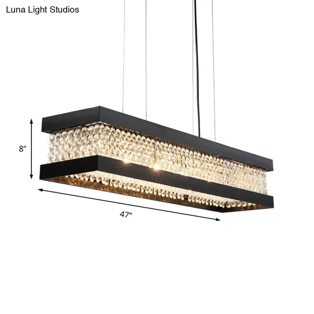 Black rectangular DecorBites™ pendant lighting with black gold frame and cascading clear crystal droplets for island use