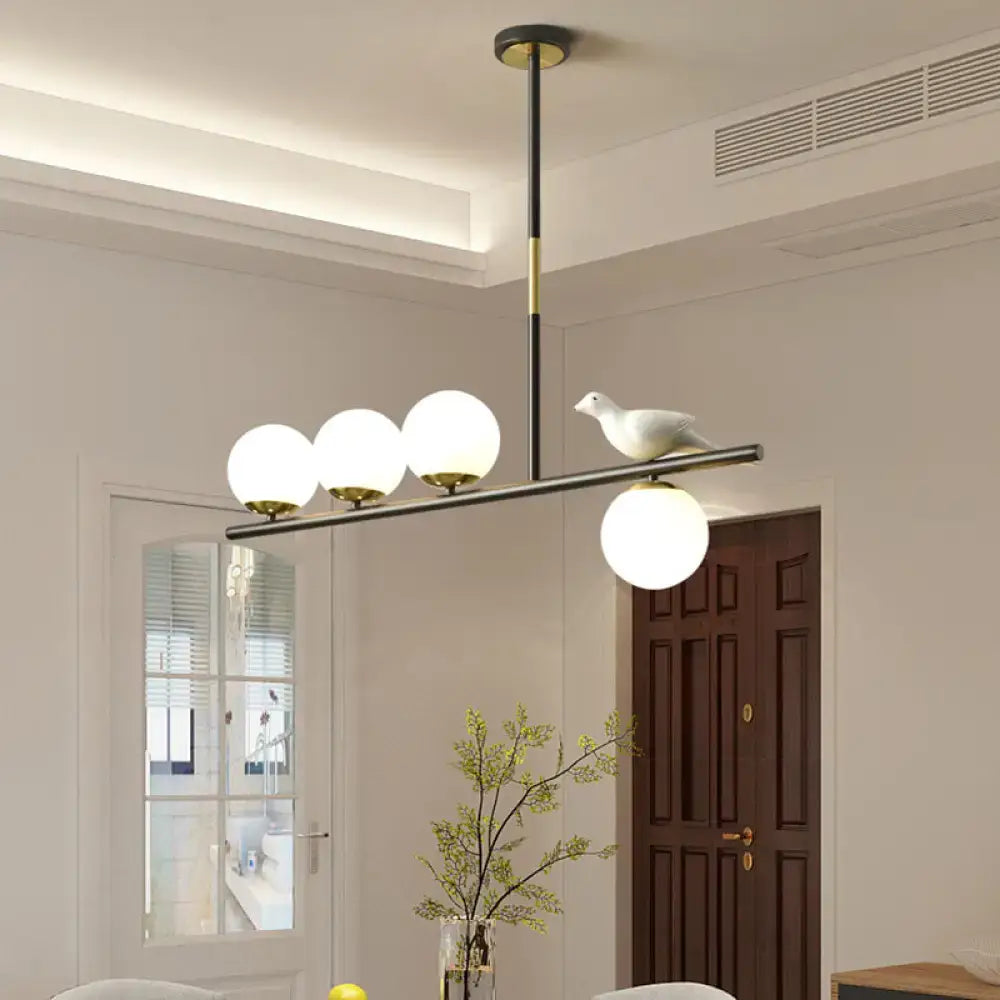 Decorbites contemporary black and gold linear branch dining pendant light with frosted globes and ceramic dove for dining room island