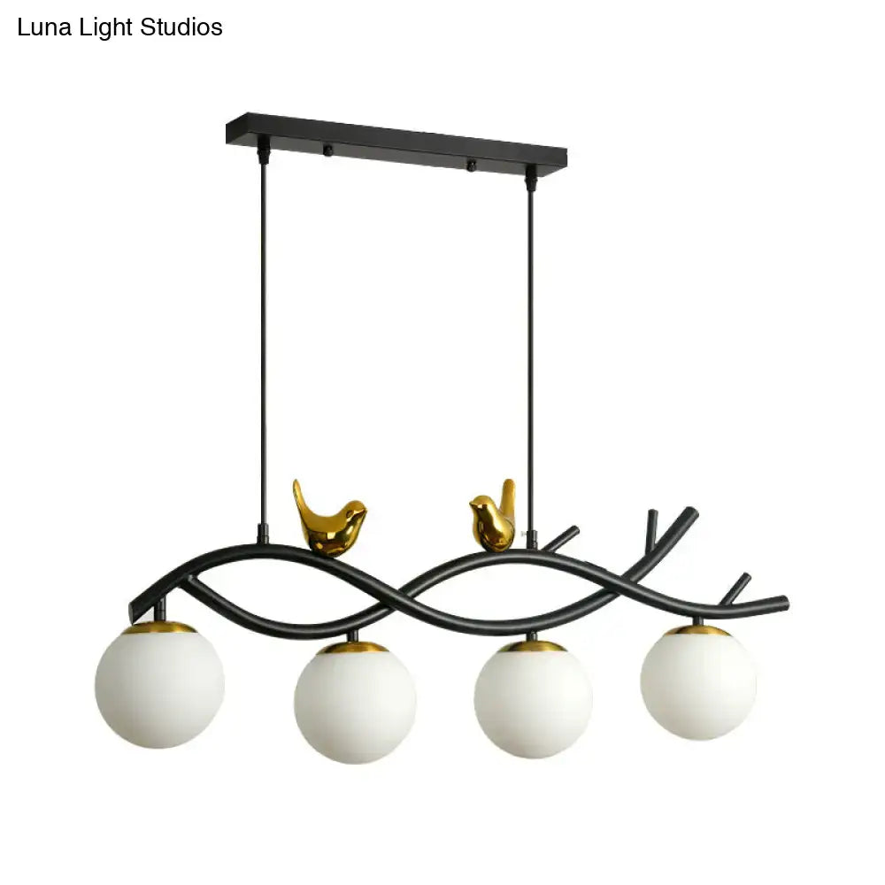 Decorbites contemporary black metal linear branch dining chandelier with gold bird accents and cream glass shades