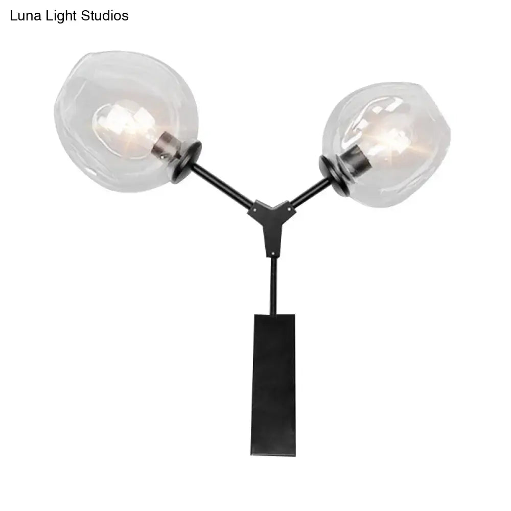 Contemporary black metal wall sconce with two clear glass shade globes for elegant bedroom light wall decor