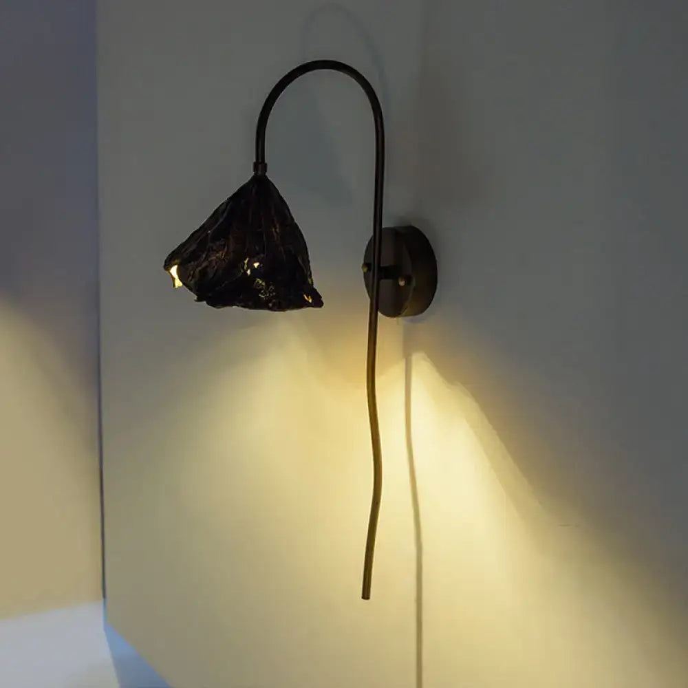 Contemporary black wrought iron wall light with sculpted lotus leaf shade for living room sconce