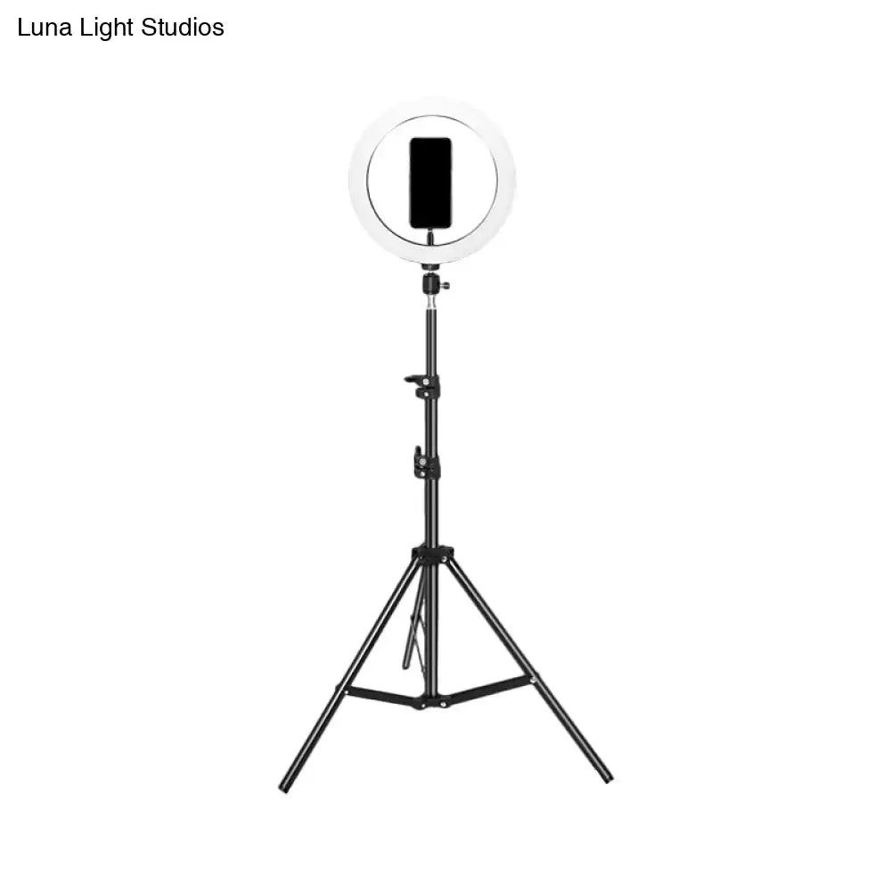 Contemporary black metal flash lamp with usb port and bulb included featuring a tripod-mounted ring light holding a smartphone