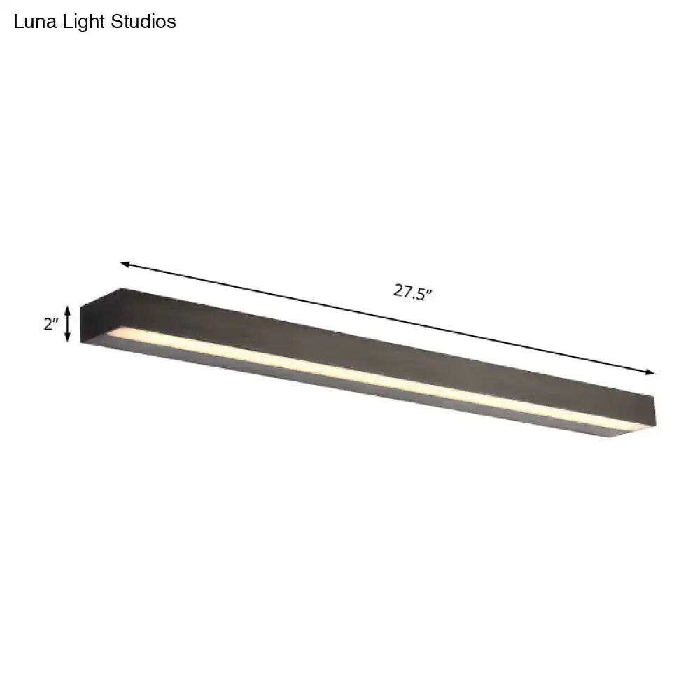 Contemporary black and silver linear vanity sconce with matte black rectangular led fixture and warm white illumination