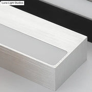 Contemporary black and silver linear vanity sconce with silver brushed aluminum and frosted glass panel for white warm light