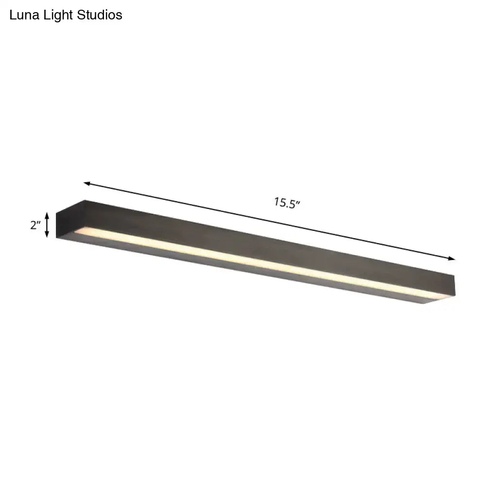 Contemporary black and silver linear vanity sconce with sleek matte black finish and white warm led illumination