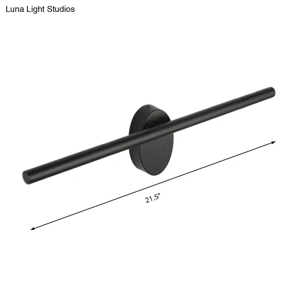 Contemporary black matte wall light with slim cylindrical bar and circular base for natural light in bedroom