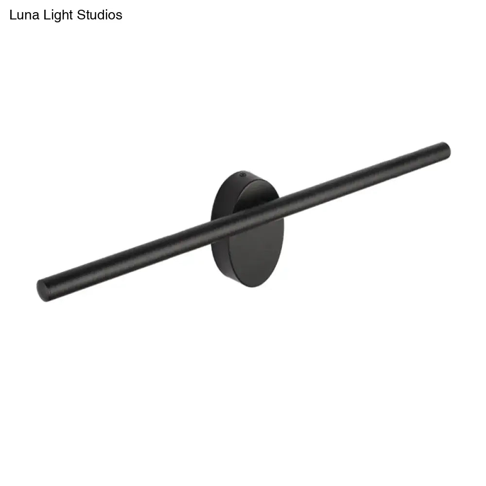 Contemporary black matte wall light with slim cylindrical bar and circular base designed for natural light in bedrooms