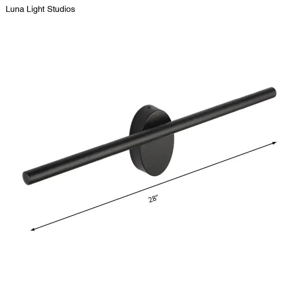 Contemporary black matte wall light with slim cylindrical bar and circular base for natural light in bedroom