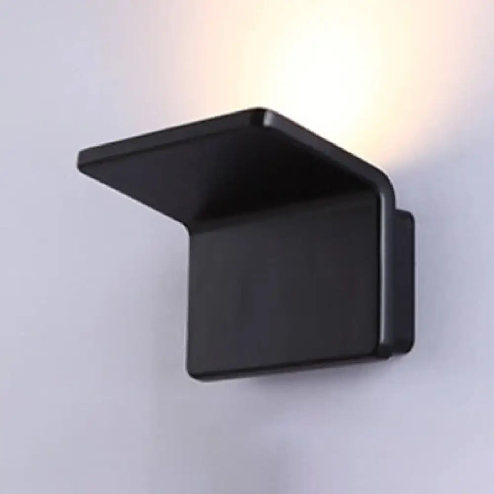Contemporary black and white slatted wall lamp with black matte finish and modern angular design for living room use