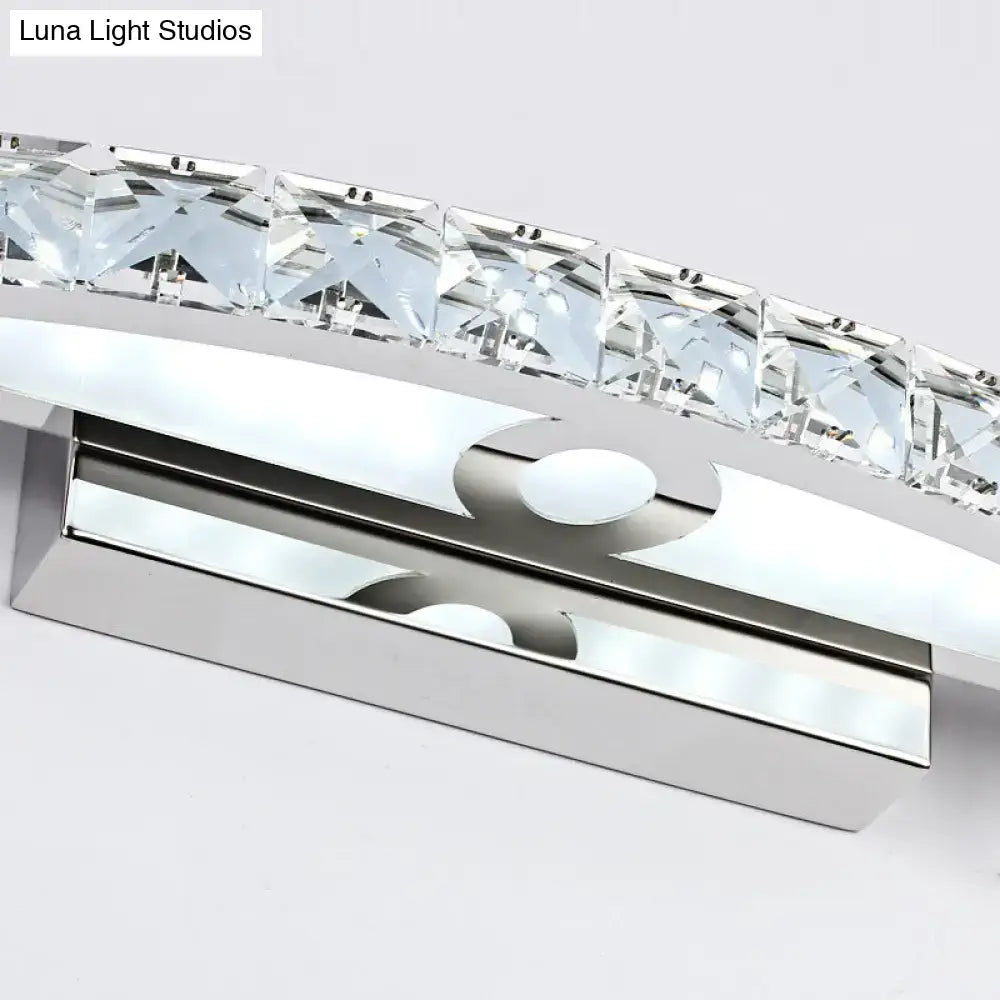 Contemporary bow shaped silver vanity lighting wall sconce with chrome finish and faceted clear crystal accents