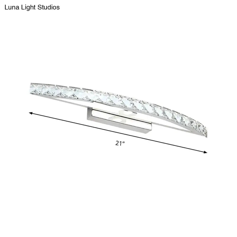 Contemporary silver bow shaped wall sconce with crystal accents designed for vanity lighting in bathrooms