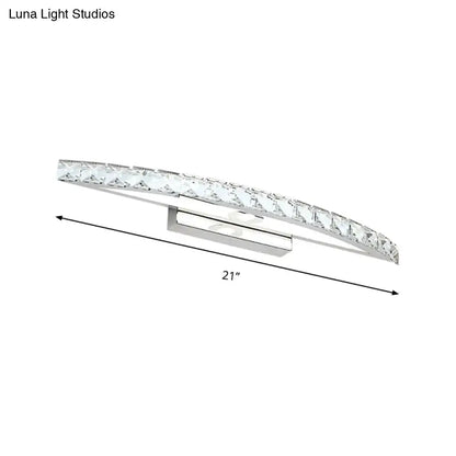 Contemporary silver bow shaped wall sconce with crystal accents designed for vanity lighting in bathrooms