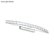 Contemporary bow shaped silver vanity lighting wall sconce with chrome finish and clear faceted crystal accents