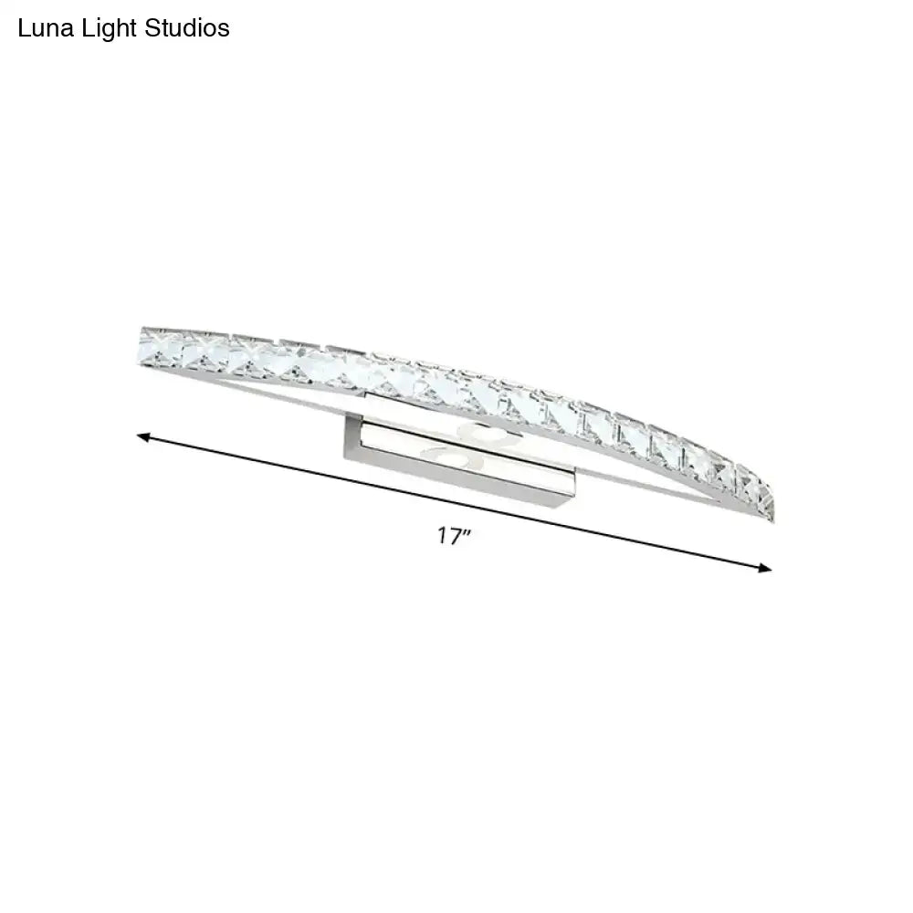 Contemporary silver bow shaped wall sconce with clear faceted crystals for vanity lighting in bathroom