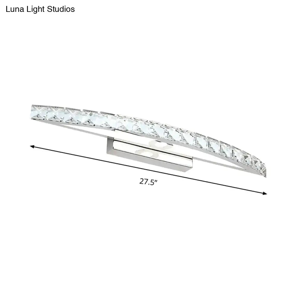 Contemporary silver bow shaped wall sconce with clear crystal accents for vanity lighting in bathroom settings