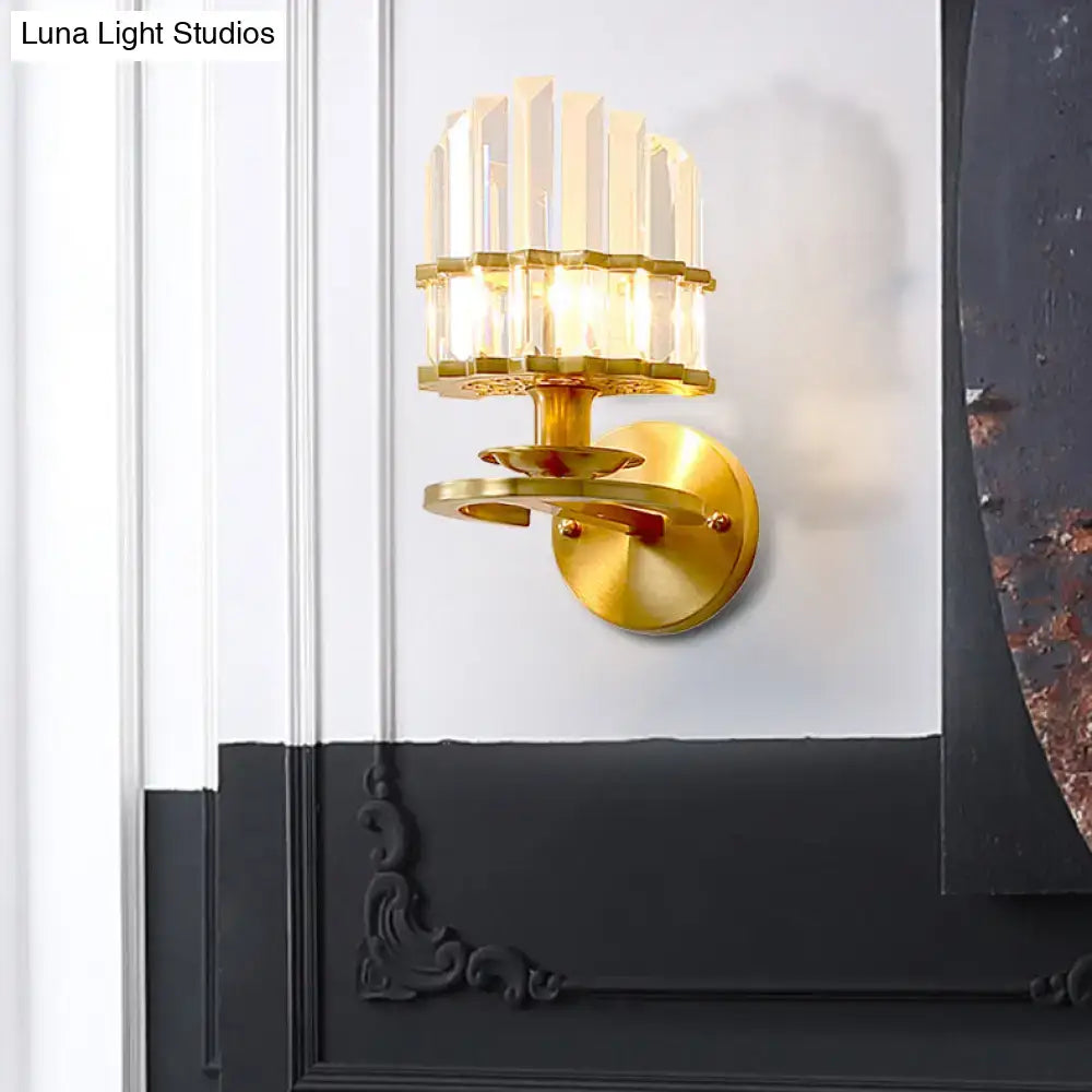 Contemporary brass wall lamp with gold tone circular base and clear crystal vertical accents compatible with e12 e14 bulbs