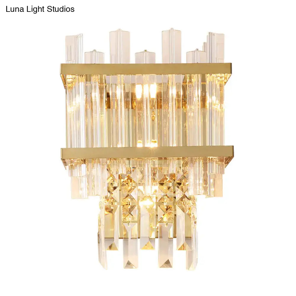 Gold-toned contemporary brass chrome wall lamp with tiered crystal accents and vertical glass rods for dining room use