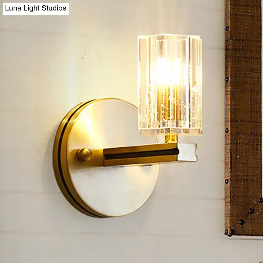 Contemporary brass crystal cylinder sconce light with gold-toned prismatic crystal cylinder shade for bedroom wall mount