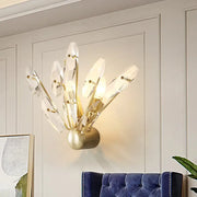 Contemporary gold-toned brass crystal sputnik wall sconce with faceted glass pieces for stylish living room wall light