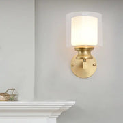 Contemporary brass wall mounted light fixture with frosted glass shade in gold tone for living room use
