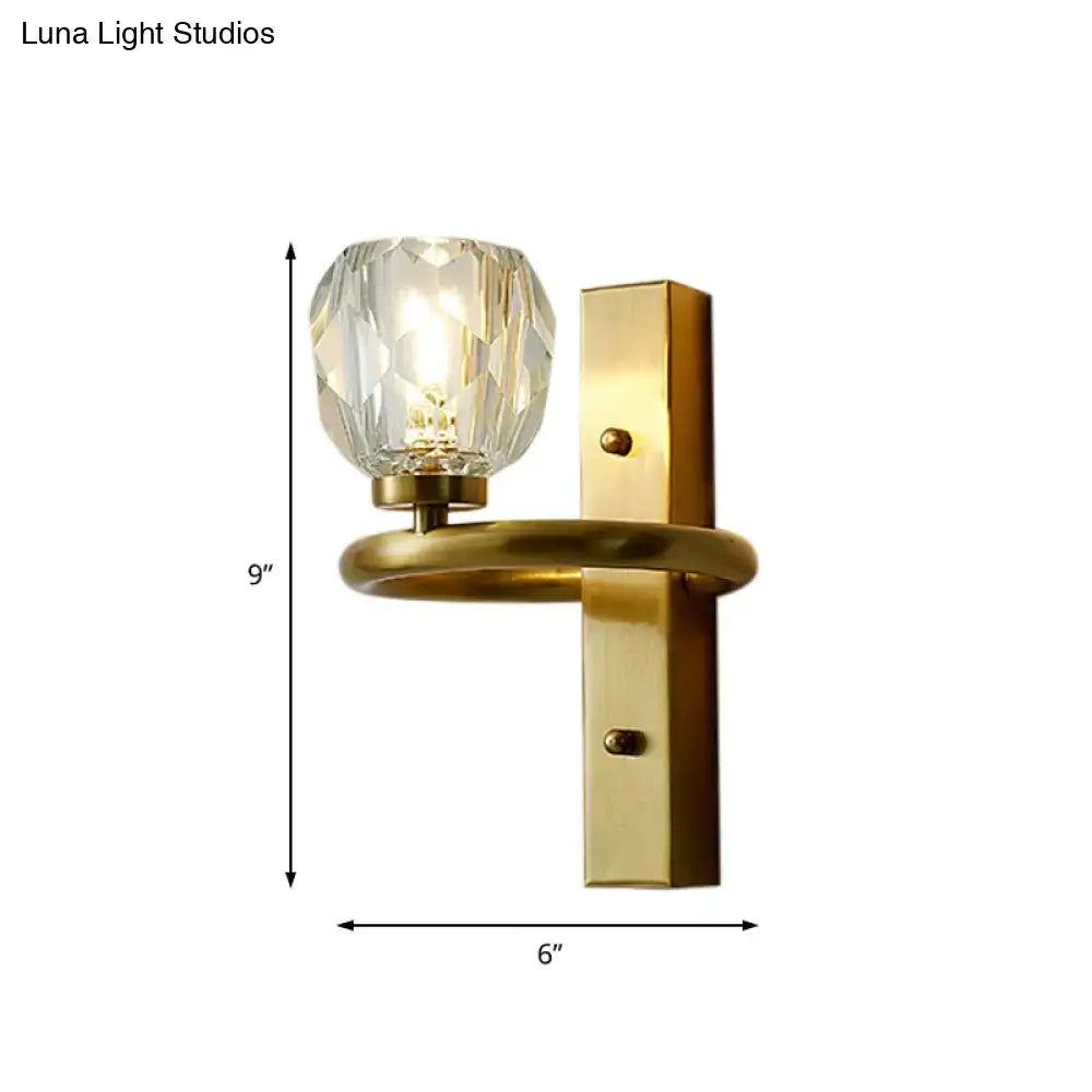 Contemporary brass wall sconce with a faceted global crystal shade for dining room use 220v-240v 110v-120v compatible