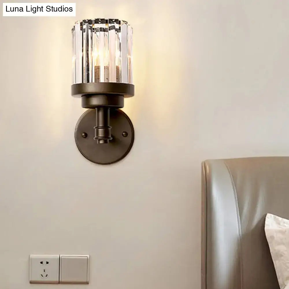 Contemporary bronze wall sconce light fixture with a sleek dark bronze finish and ribbed crystal shade for hallway lighting