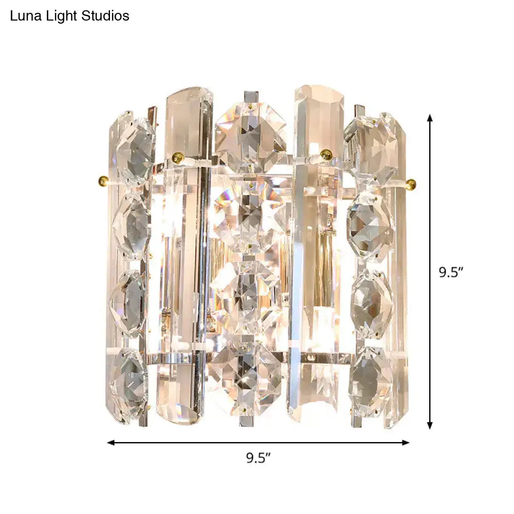 Contemporary chrome 2-light wall lamp featuring a modern crystal wall lamp with clear faceted glass and gold-toned accents