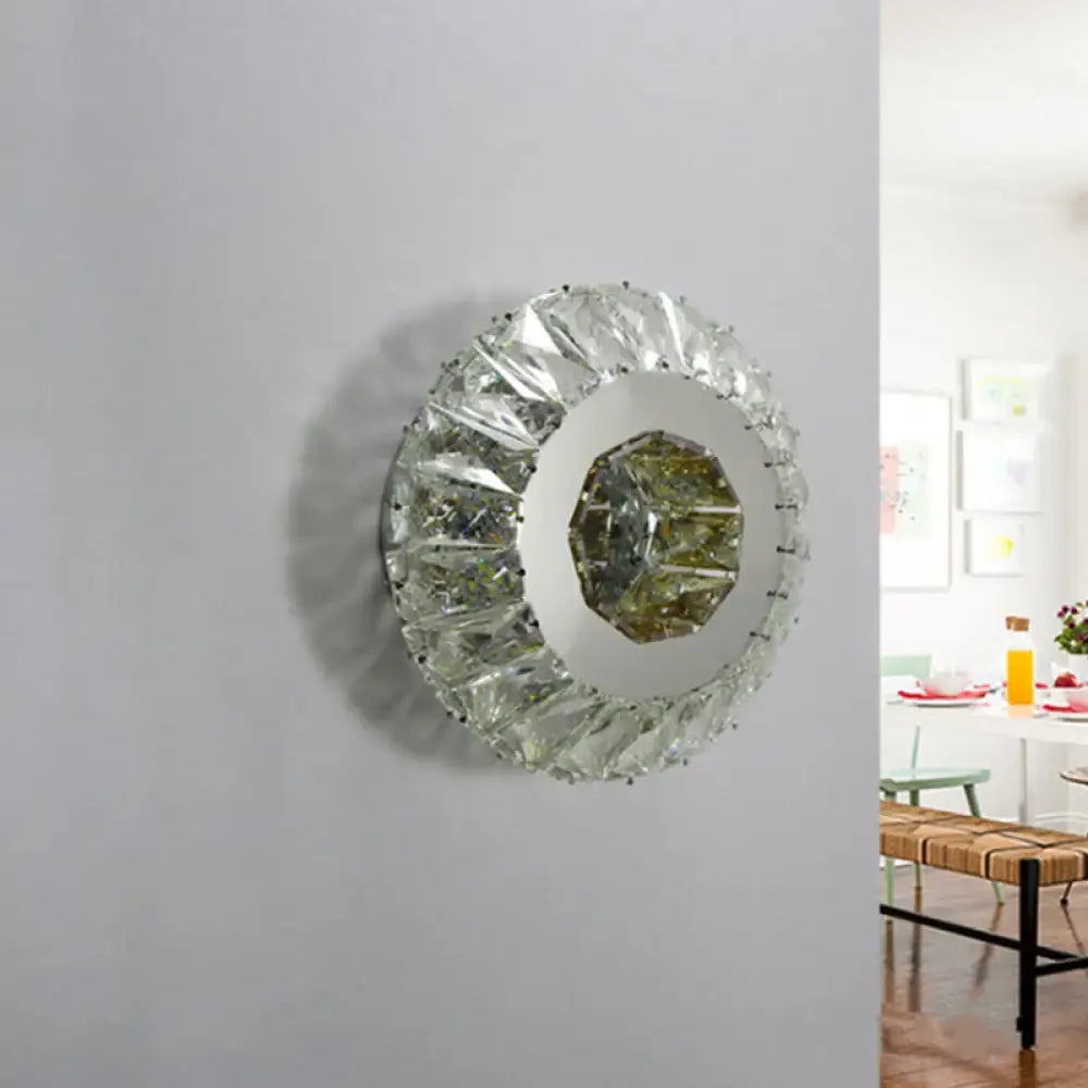 Contemporary chrome crystal wall lamp featuring a round faceted mirror with octagonal central glass panel