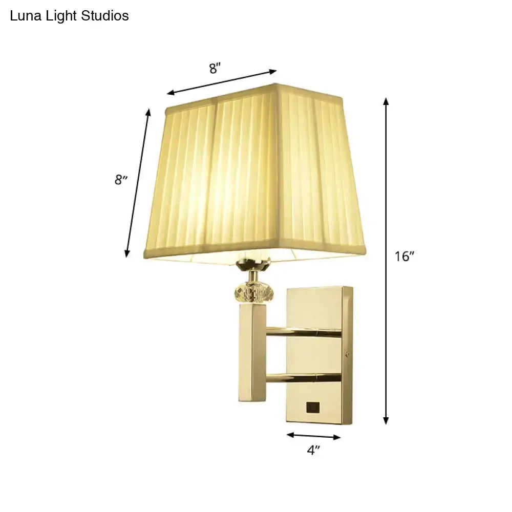 Gold-finished contemporary light fixture wall sconce with square pleated beige lampshade crystal accent and spot light