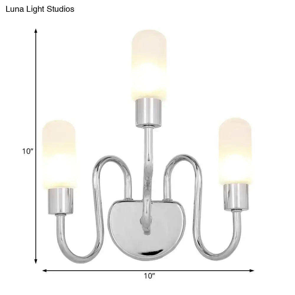 Contemporary chrome three-light wall sconce with frosted milk glass shades for bedroom lighting