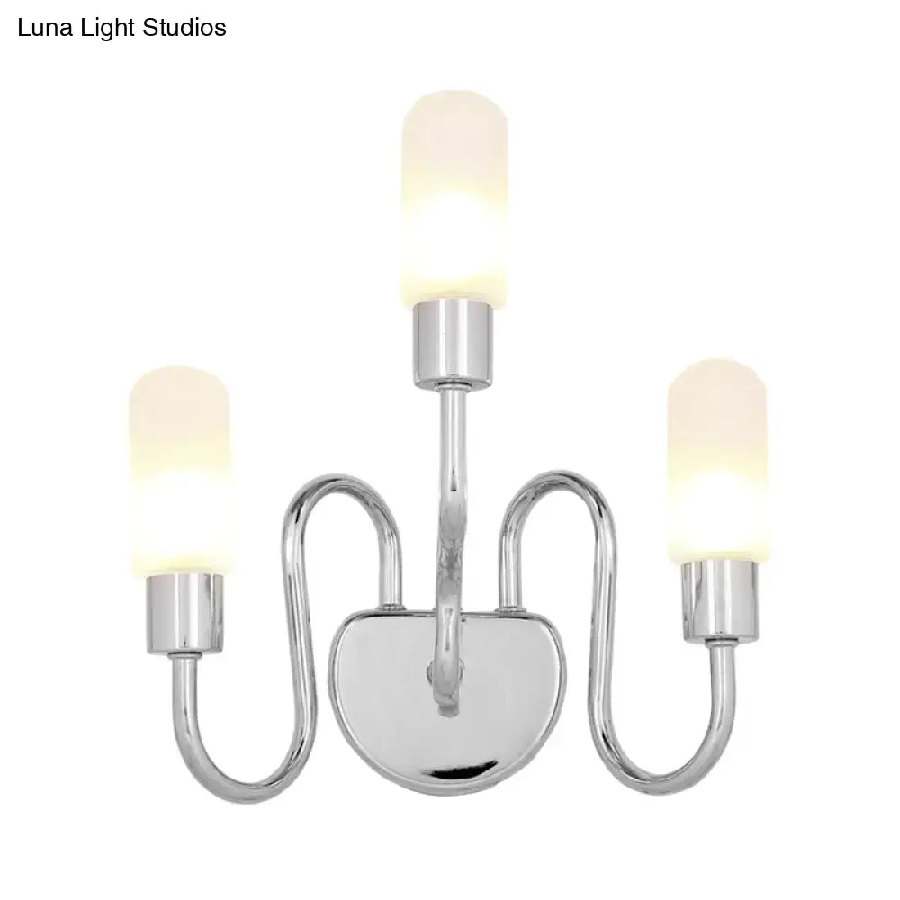 Contemporary chrome three-light wall sconce with frosted milk glass shades for bedroom lighting