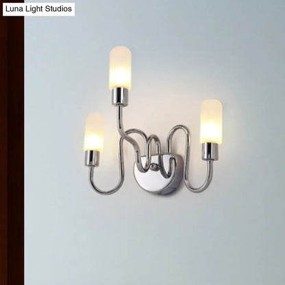 Contemporary chrome bedroom wall sconce with three curved arms and frosted milk glass shades for elegant lighting