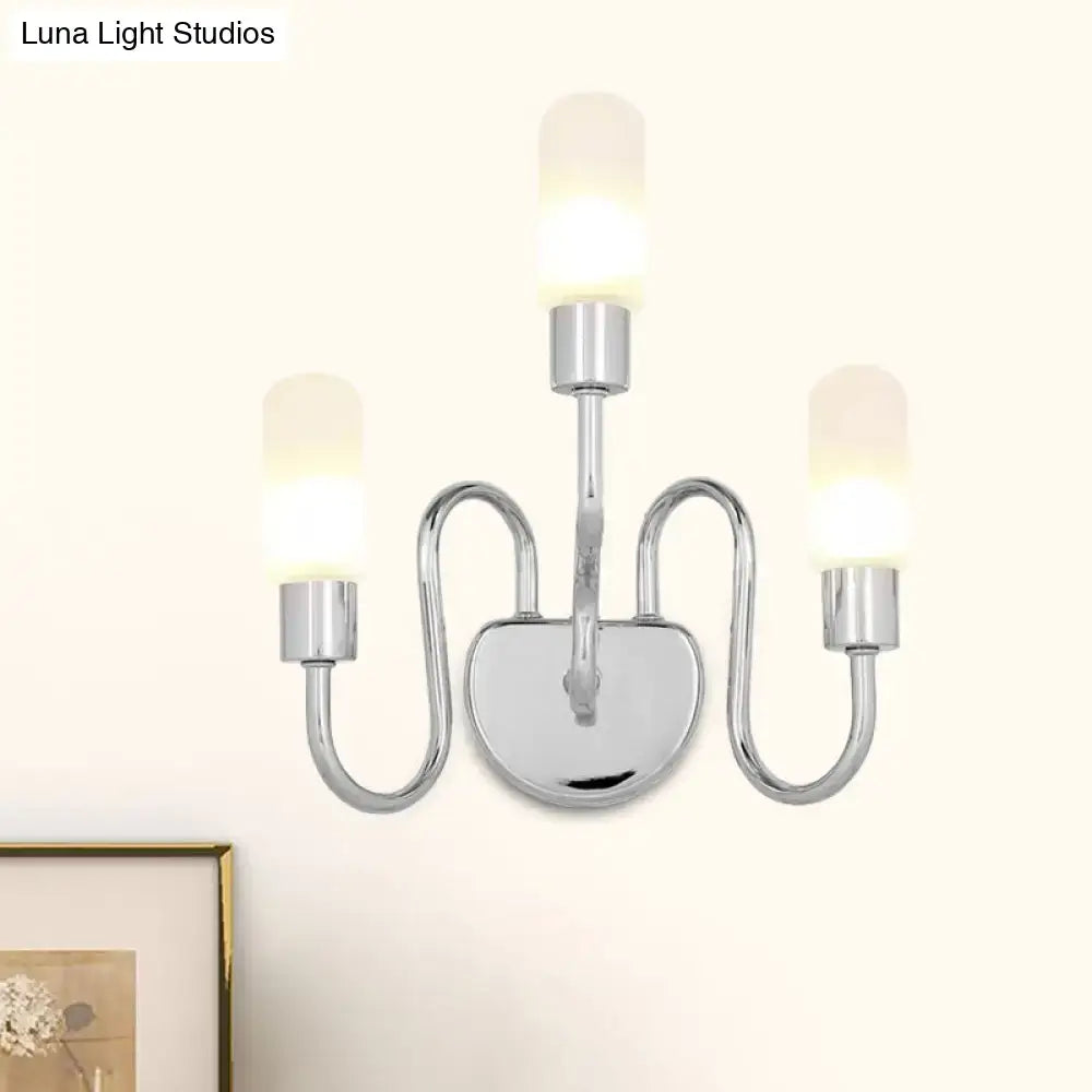 Contemporary chrome three-light wall sconce with frosted milk glass shades for bedroom lighting