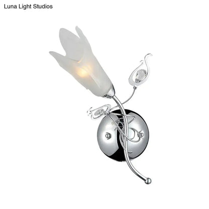 Contemporary chrome e12 wall sconce with frosted opal glass petal shade and crystal accents for bedroom lighting