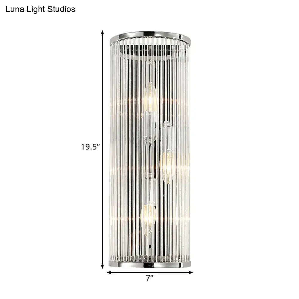 Contemporary chrome wall sconce with clear crystal tube vertical glass rods and three exposed led incandescent fluorescent bulbs