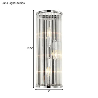 Contemporary chrome wall sconce with clear crystal tube vertical glass rods and three exposed led incandescent fluorescent bulbs