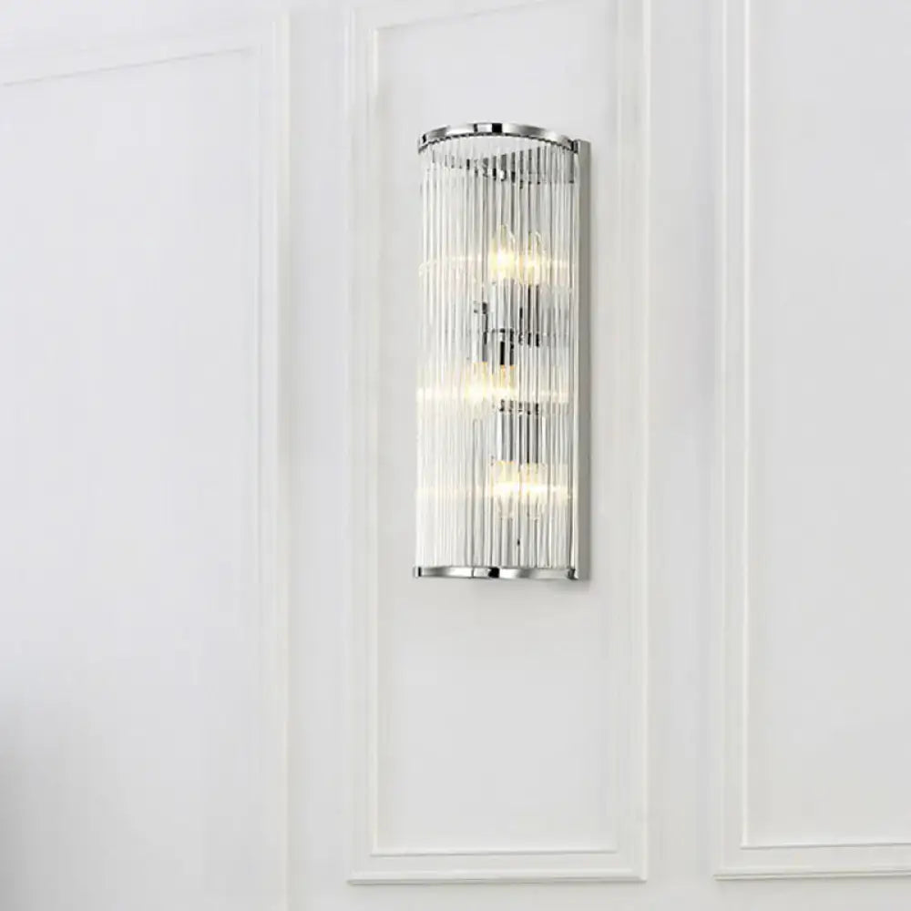 Contemporary chrome wall sconce with vertical clear crystal tube and three warm led incandescent fluorescent lights for bedroom