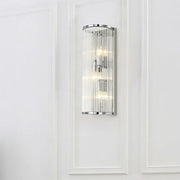 Contemporary chrome wall sconce with vertical clear crystal tube and three warm led incandescent fluorescent lights for bedroom