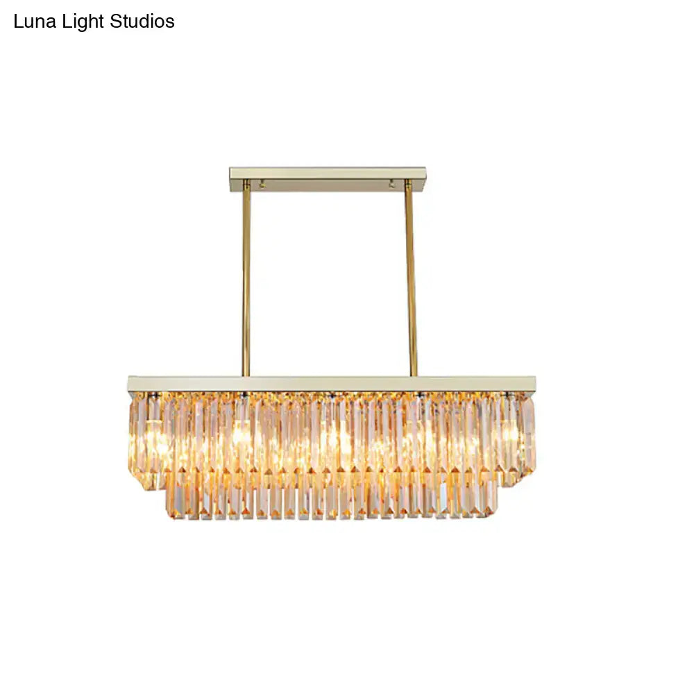 Gold-toned rectangular dining room chandelier with cascading clear amber crystal prisms light fixture