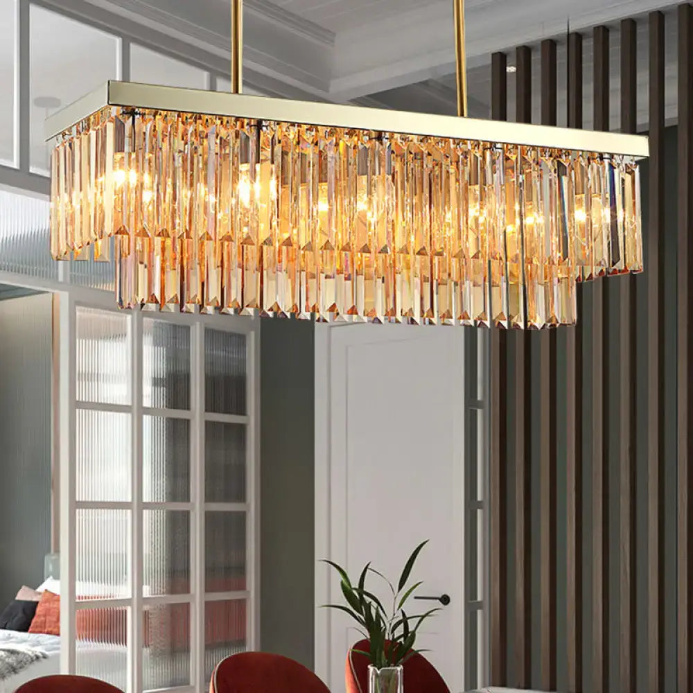 Gold-toned rectangular dining room chandelier with cascading clear amber crystal prisms light fixture